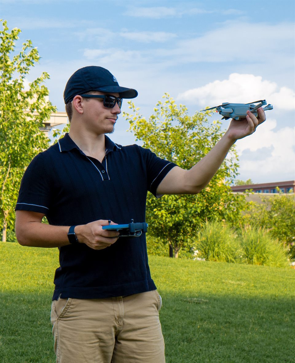 Aerial Detroit drone pilot preparing an aircraft outdoors