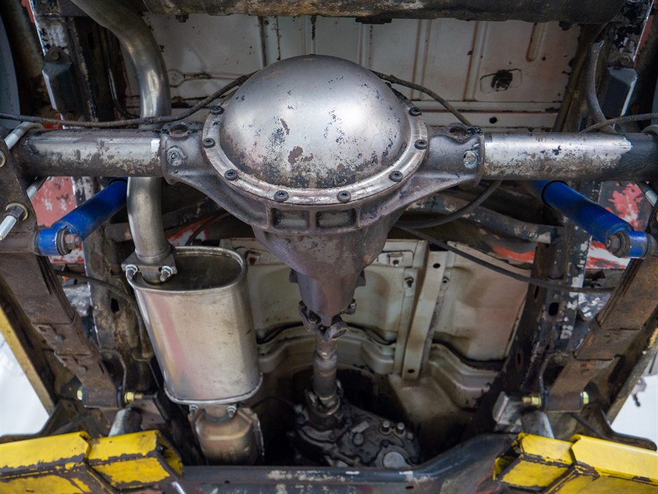 Automotive service process photographed from below