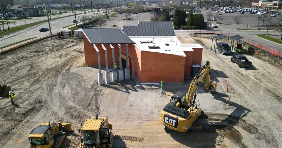 Aerial view of a building and active earthwork